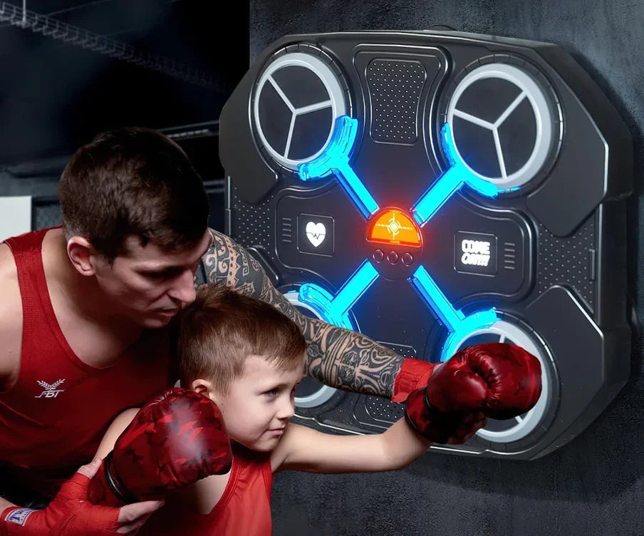 A child practicing with a TU SHOP boxing machine for kids while a trainer assists.